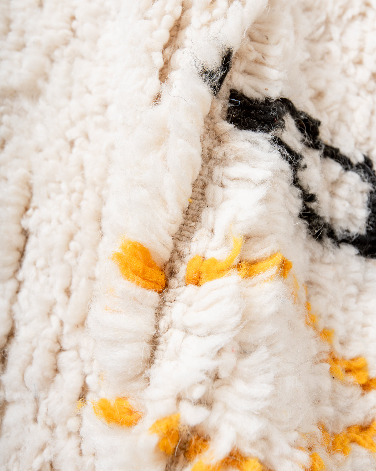 Modern, designer, handcrafted Berber rug from Morocco. Beniourain carpet with beautiful colours and patterns and fluffy wool texture.